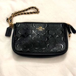 Black Coach wrist clutch.